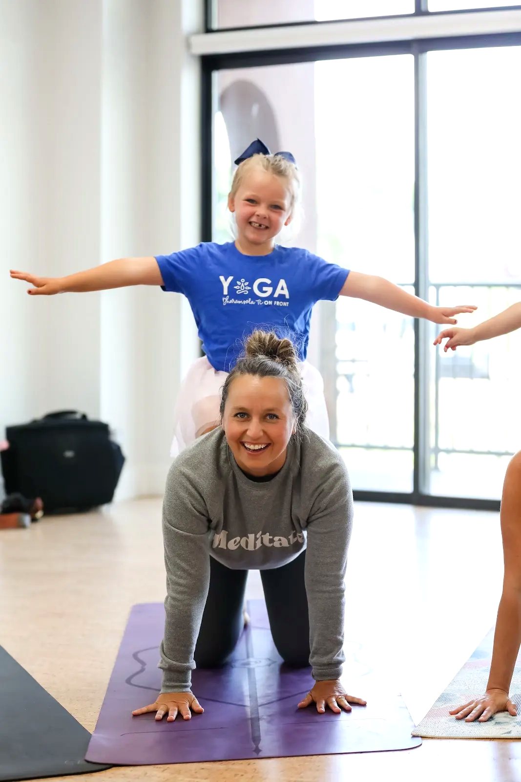 Adults learning through movement, play and cooperation at Rainbow Yoga