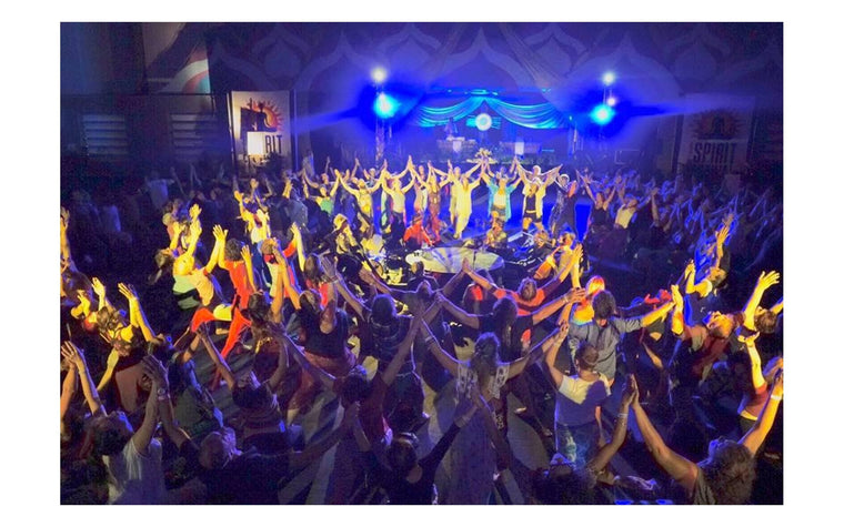 Rainbow Yoga participants creating connected circles together