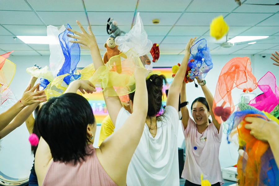Rainbow Kids Yoga teacher training participants practising together