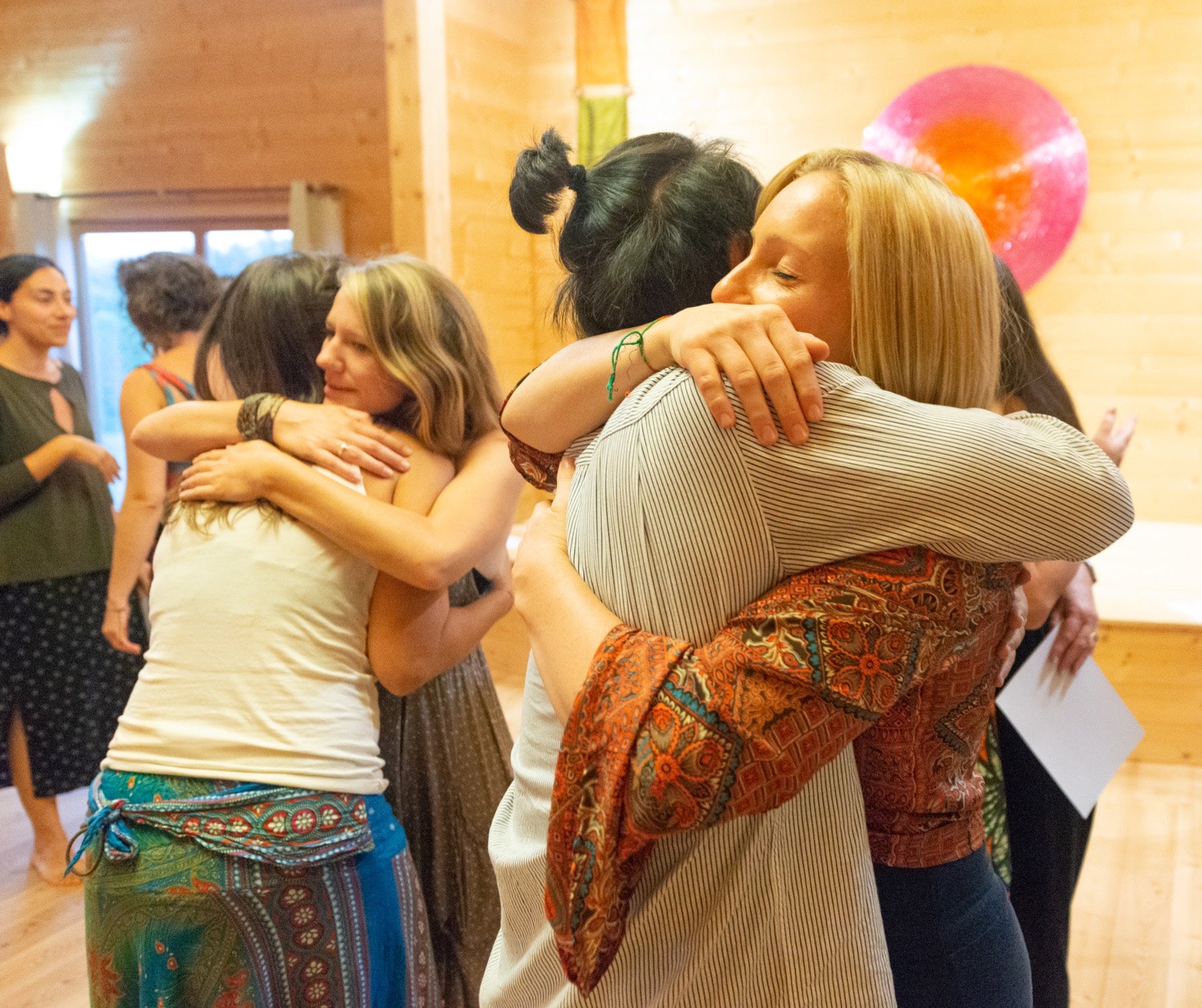 Rainbow Yoga trainees sharing warm hugs and human support after training