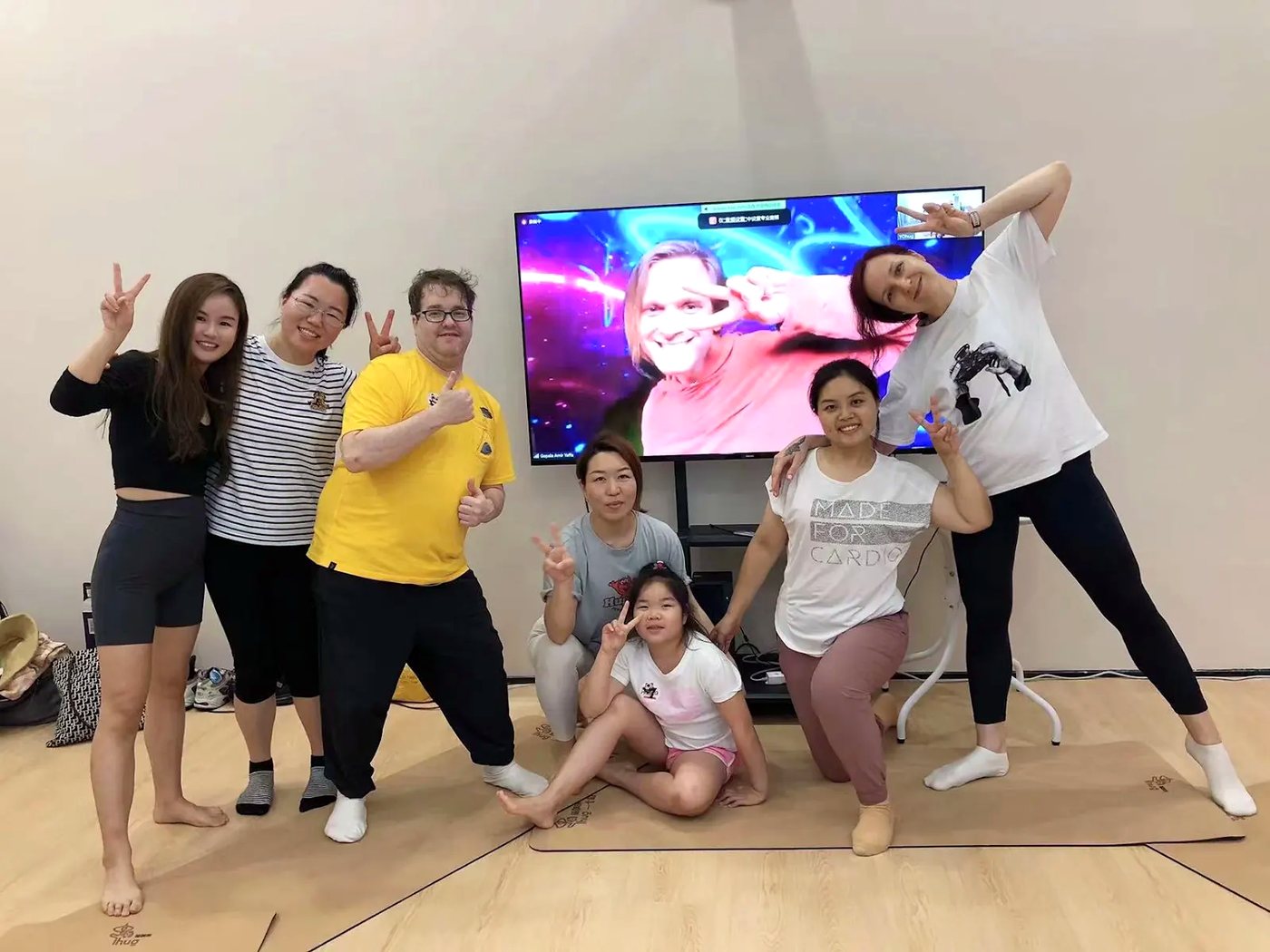 Rainbow Yoga graduates smiling together after training